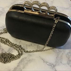 Rhinestone brass knuckles clutch with chain strap